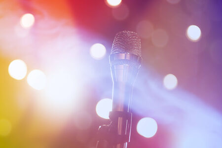 Microphone on stage with shiny rays as the backgroundの写真素材