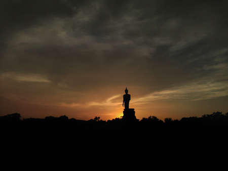 Buddha statue in sunsetの写真素材