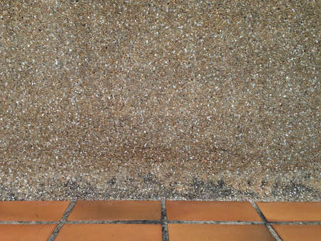 Sand wall background texture with brick floor under frameの写真素材