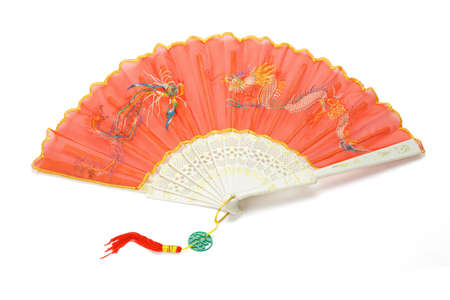 Open red Chinese folding fan with dragon and peonix design on white backgroundの写真素材