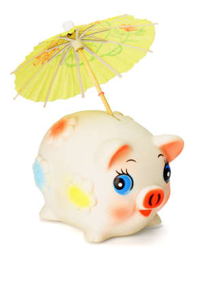 Saving for raining days - Cute piggy bank with colorful umbrella on white backgroundの写真素材