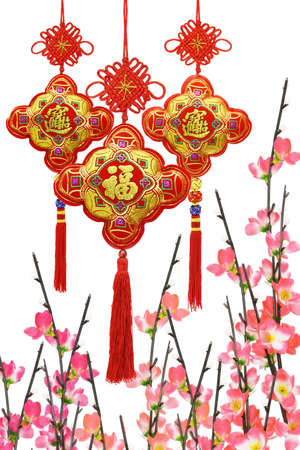 Chinese New Year traditional ornaments and plum blossom on white backgroundの写真素材