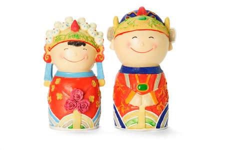 Chinese wedding bride and bridegroom figurines on white backgroundの写真素材