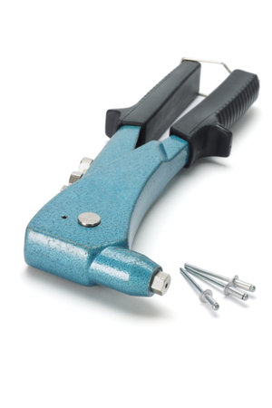 Rivet applicator and three pieces of rivets on white backgroundの写真素材