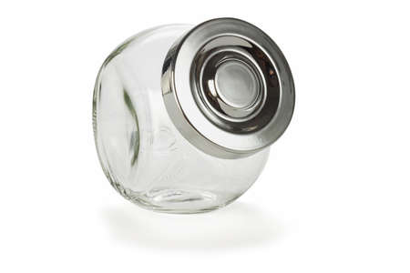 Glass jar for spices with lid on white backgroundの写真素材