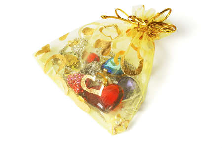 Colorful jewelry in gold pouch on white backgroundの写真素材