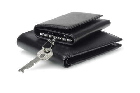 Black leather key case and wallet on white backgroundの写真素材
