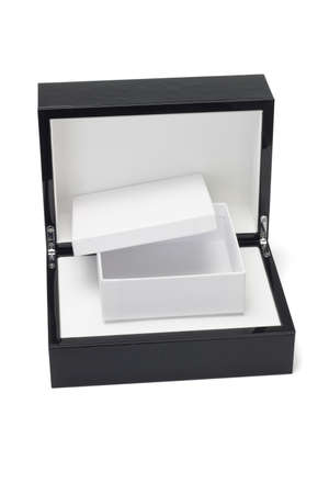 Open gift box in a black hard case  on white backgroundの写真素材