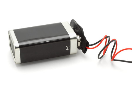 9v battery attached to connector on white background