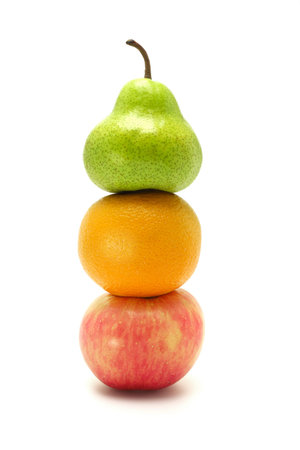 stack of apple, orange and pear on white backgroundの写真素材