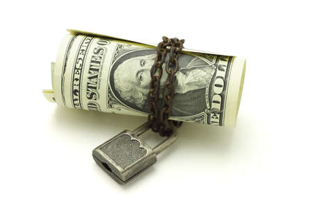 US dollars chained and locked on white backgroundの写真素材
