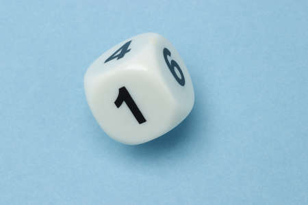 White dice with numbers 1, 4 and 6 on blue background の写真素材
