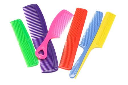 Assorted multicolor plastic combs on white backgroundの写真素材