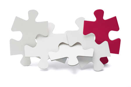 Jigsaw puzzle pieces interlocked and standing on white backgroundの写真素材