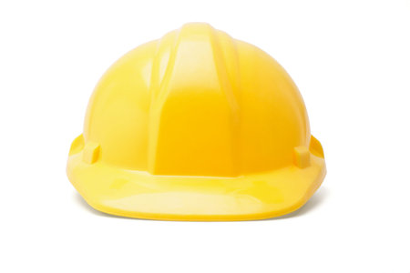 Yellow hardhat safety helmet on white background