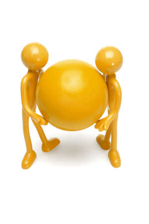 Rubber toy figurines holding large ball on white backgroundの写真素材
