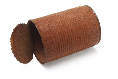 Old rusty tin can lying on white backgroundの写真素材