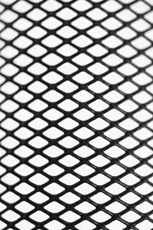 Black wire mesh pattern on white backgroundの写真素材