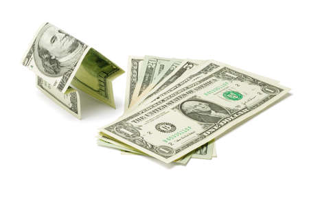 Money house and US dollars on white backgroundの写真素材