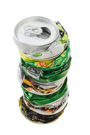 Stack of crushed cans ready for recycling on white background