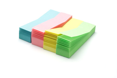 stacks of colorful narrow sticky packs on white