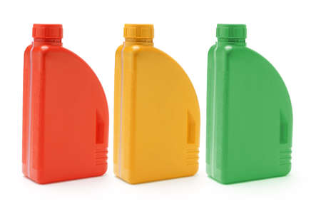 Three color containers of motor oil on white backgroundの写真素材