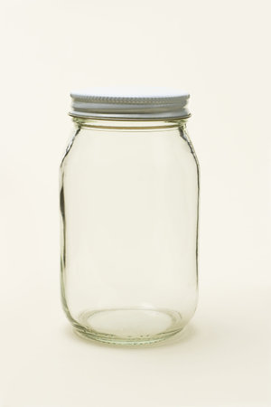 Empty glass jar on seamless color backgroundの写真素材