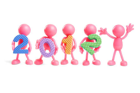 Faceless rubber figurines holding colorful new year 2012 number blocks on white backgroundの写真素材