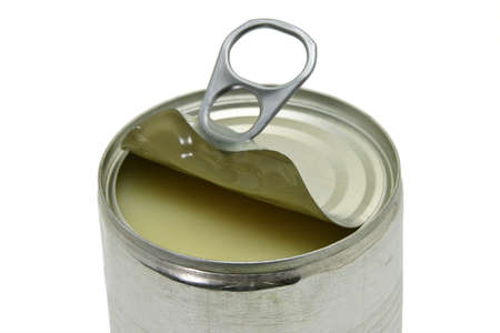 Close up of an opened can of condensed milk on white backgroundの写真素材