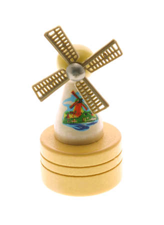 Miniature wooden windmill souvenir on white backgroundの写真素材