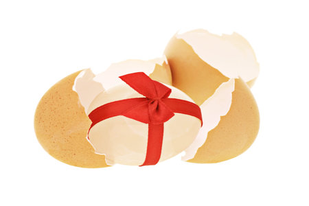 Easter egg in egg shells isolated on white background