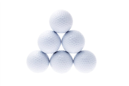 Golf balls stacked up in triangular shapeの写真素材