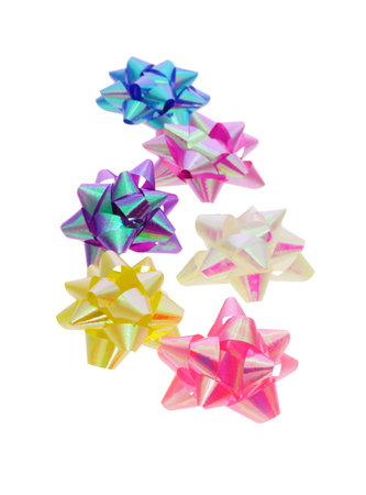 Decorative color bows arranged on white background