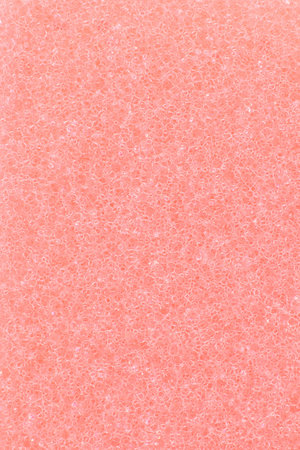 Close up of red cleaning sponge surface texture for backgroundの写真素材