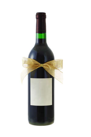 Bottle of red wine decorated with bow ribbon on white の写真素材