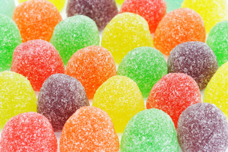 Rows of multicolor sugar coated soft jelly candies background