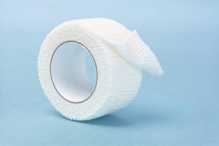 White Elastic Medical Bandage on Blue Background