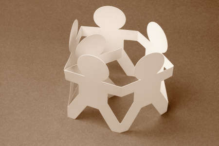 Circle of Paper Chain Surrounding and Protecting a Memberの写真素材