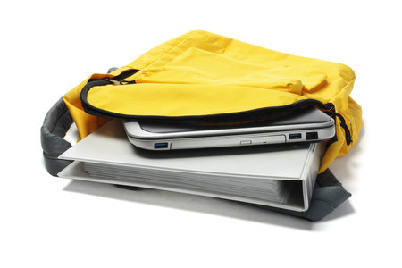 Laptop And File In Yellow Backpack On White Background