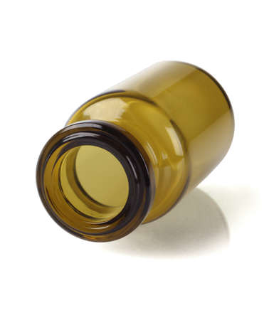 Open Glass Bottle Lying on White Backgroundの写真素材