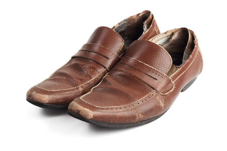 Old Pair of Used and Worn Brown Leather Shoes on White Backgroundの写真素材
