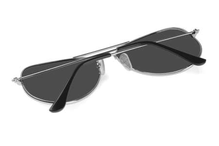 Sunglasses With Metal Frame Lying on White Backgroundの写真素材