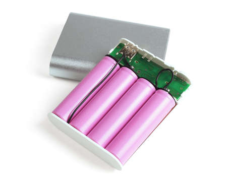 Open Power Bank Exposing Internal Batteries on White Backgroundの写真素材