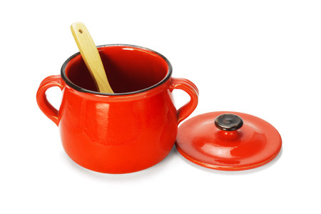 Empty Red Clay Pot with Wooden Scoop on White Backgroundの写真素材