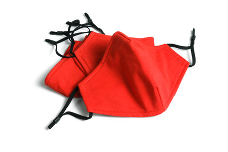Red Fabric Face Masks on White Backgroundの写真素材