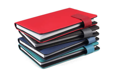Stack of Colourful Diaries on White Backgroundの写真素材