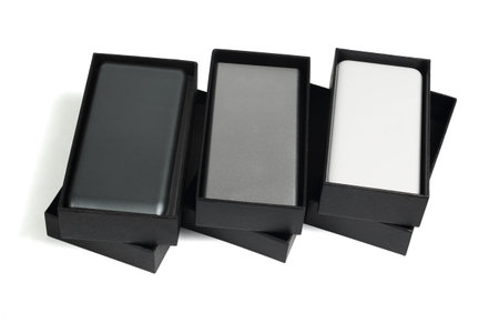Three Boxes of Handphone Power Banks on White Background
