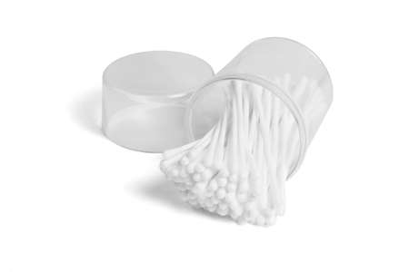 Cotton Swabs in Open Plastic Container Lying on White Backgroundの写真素材