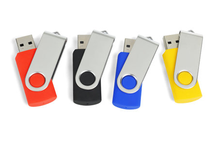 Four Colourful USB Pen Drives on White Background