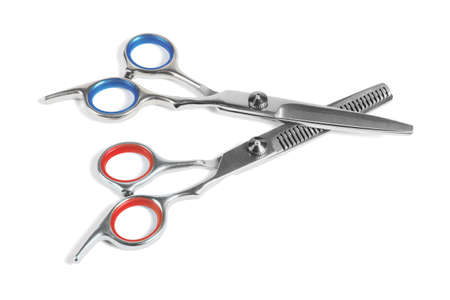 Two Pairs of Barber Scissors on White Backgroundの写真素材